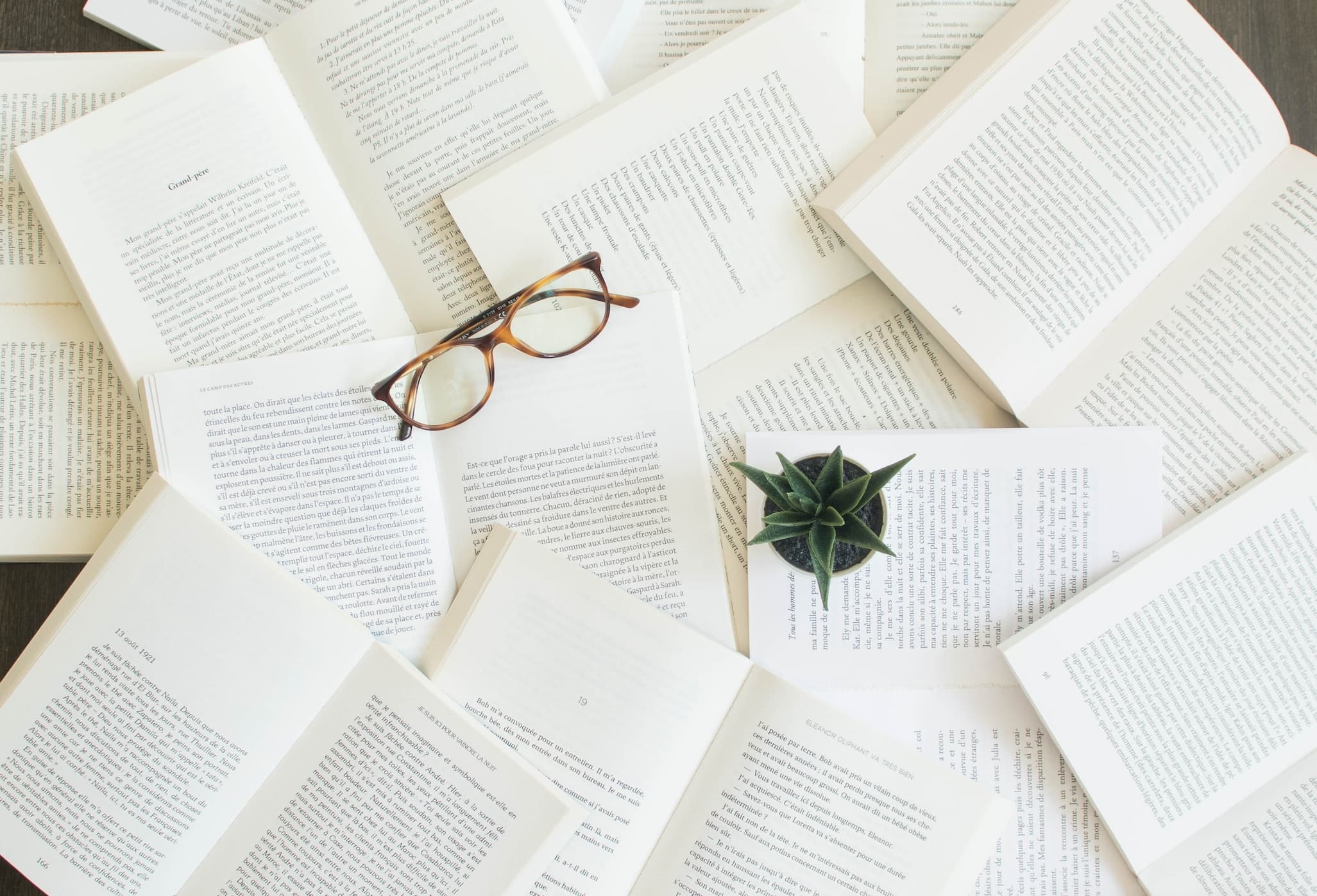 Books with glasses on top